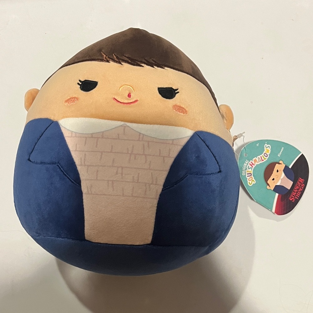 Squishmallows Eleven from Netflix’s Stranger Things Blue and Tan Plush Buddy